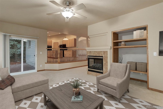14910 Williams St, Thornton, CO 80602 - living area with ceiling fan, a fireplace, and light colored carpet