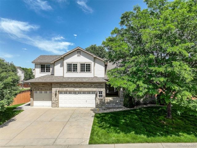 14910 Williams St, Thornton, CO 80602 - view of front of home with an attached garage, driveway, and a shingled roof