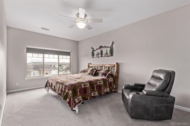 bedroom with visible vents, baseboards, ceiling fan, and carpet floors