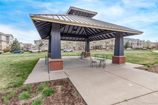 view of home's community with a yard, a gazebo, and a residential view