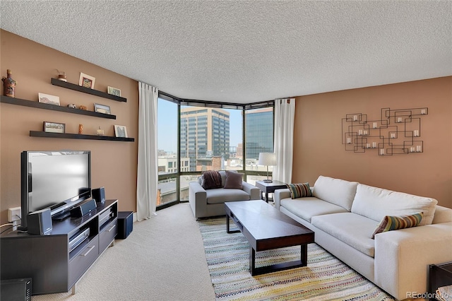 living room featuring a textured ceiling, floor to ceiling windows, and light colored carpet