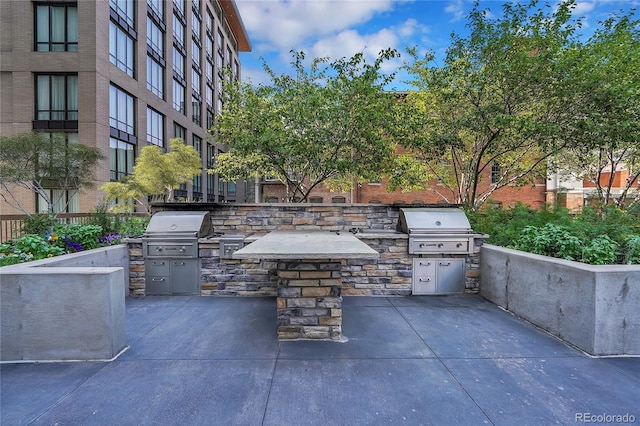 view of patio / terrace featuring exterior kitchen and area for grilling