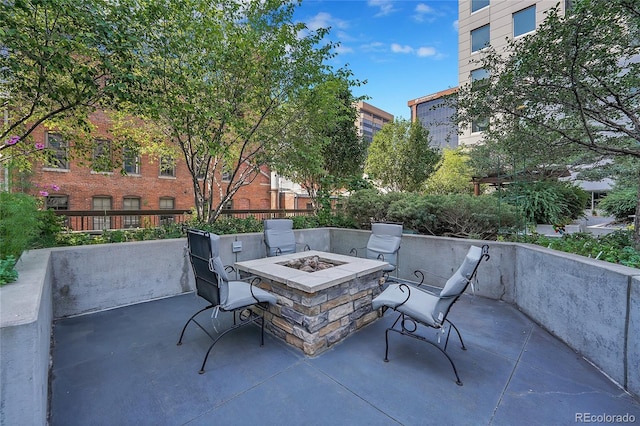 view of patio / terrace with an outdoor fire pit