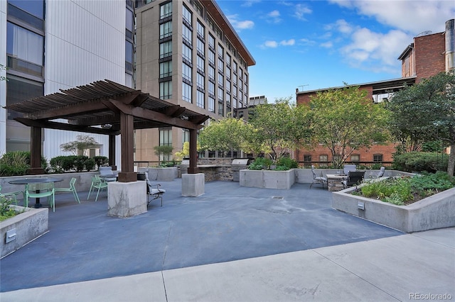 view of home's community with a patio area and a pergola