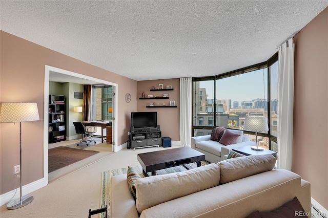 living room with expansive windows, a textured ceiling, and carpet flooring