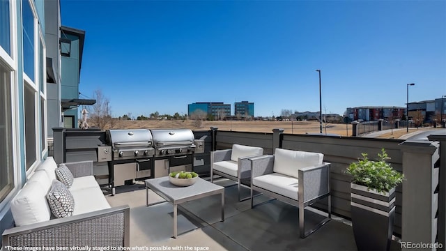 view of patio with an outdoor living space, a grill, and exterior kitchen