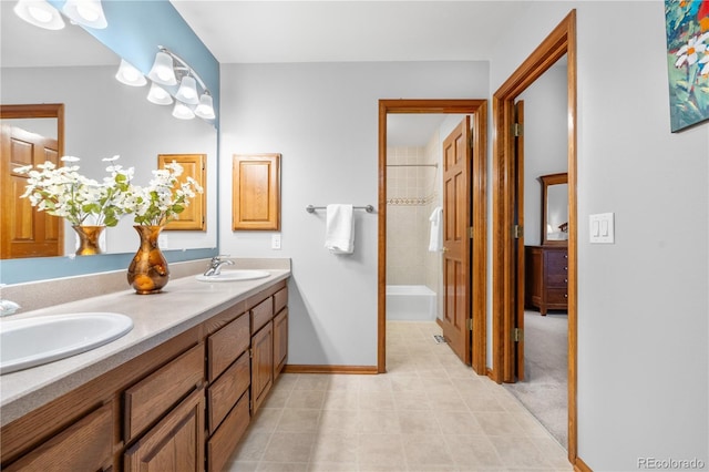 bathroom with a sink, tile patterned floors, shower / tub combination, and double vanity