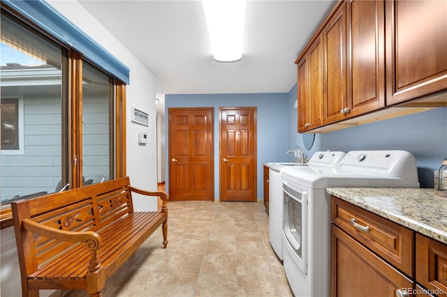 laundry area with cabinet space and washing machine and dryer