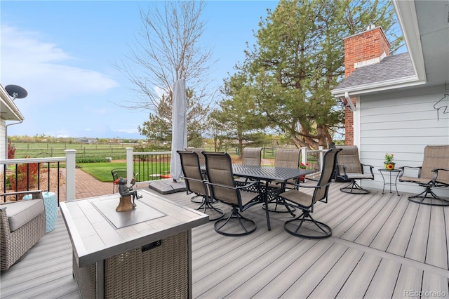 wooden terrace with fence and outdoor dining area