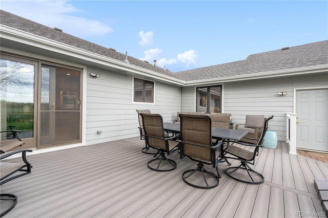 wooden deck featuring outdoor dining space