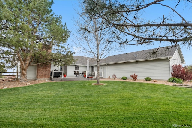 back of house featuring a patio area and a yard