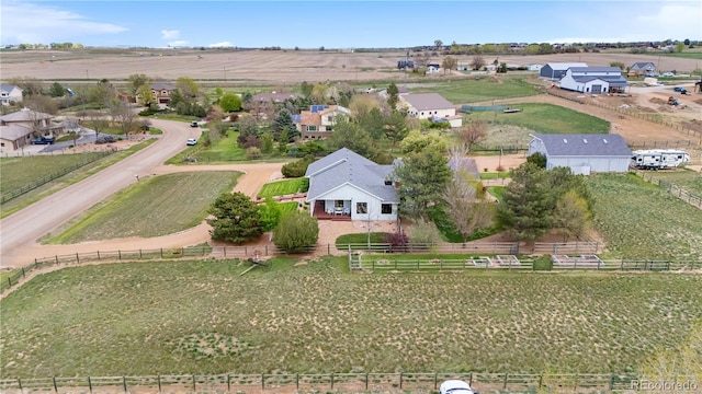 birds eye view of property featuring a residential view and a rural view