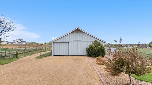 view of pole building with fence