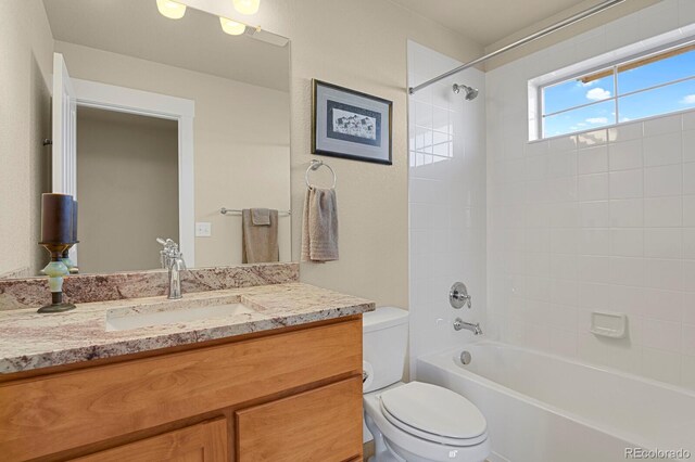 full bath with shower / tub combination, vanity, and toilet