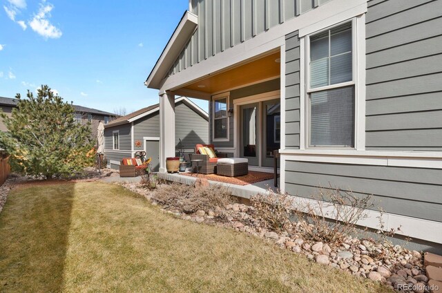 exterior space with a yard and board and batten siding