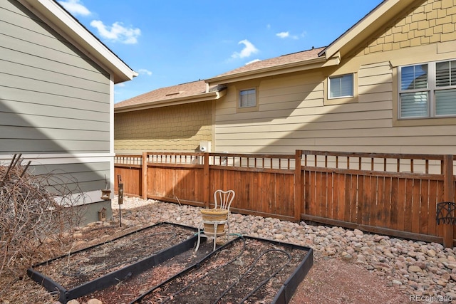 view of yard featuring a garden and fence