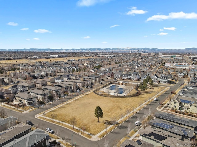 drone / aerial view featuring a residential view and a mountain view