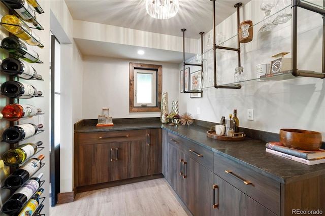 189 Pine Cone Ln, Winter Park, CO 80482 - indoor bar featuring light wood finished floors and a chandelier