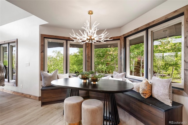 189 Pine Cone Ln, Winter Park, CO 80482 - dining area with a chandelier and light wood finished floors