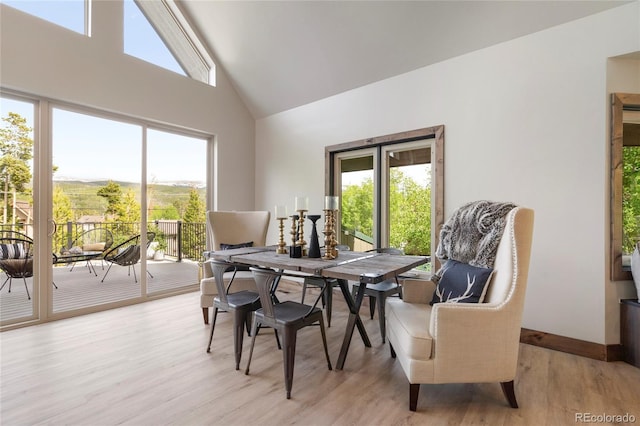 189 Pine Cone Ln, Winter Park, CO 80482 - dining space featuring plenty of natural light, light wood-style flooring, and high vaulted ceiling