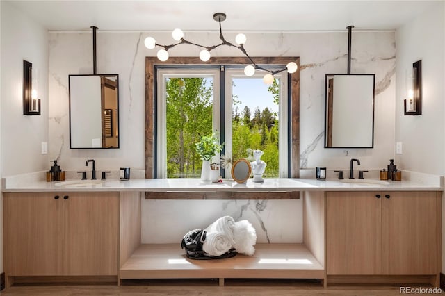 189 Pine Cone Ln, Winter Park, CO 80482 - bathroom with a chandelier and two vanities