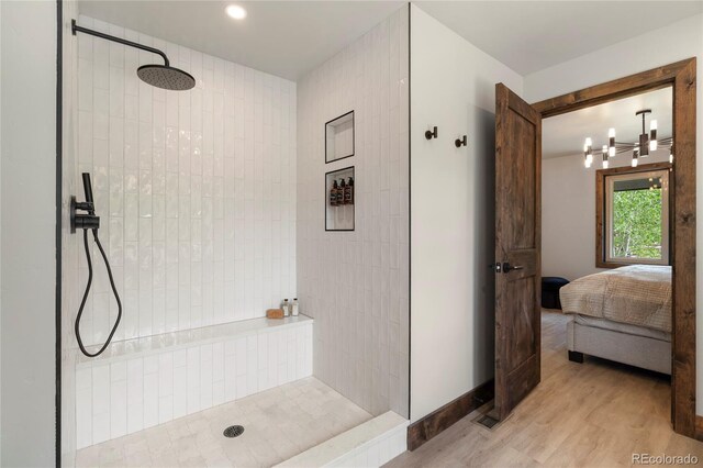 189 Pine Cone Ln, Winter Park, CO 80482 - bathroom with walk in shower, wood finished floors, ensuite bathroom, and recessed lighting