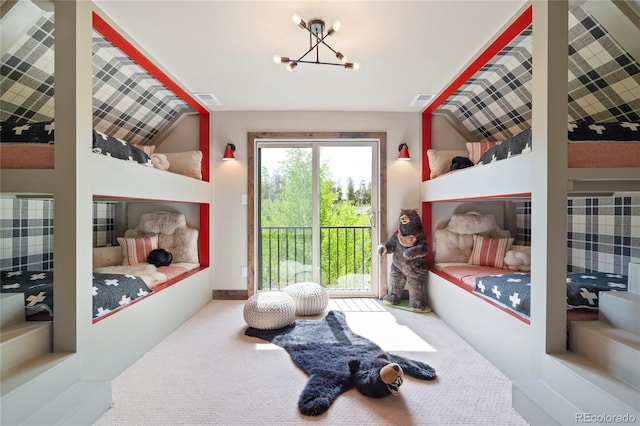 189 Pine Cone Ln, Winter Park, CO 80482 - doorway featuring carpet floors, lofted ceiling, and a chandelier