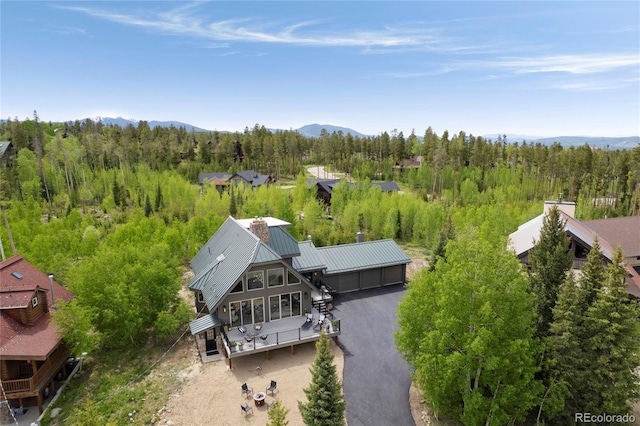 189 Pine Cone Ln, Winter Park, CO 80482 - view of subject property with a heavily wooded area and a mountainous background