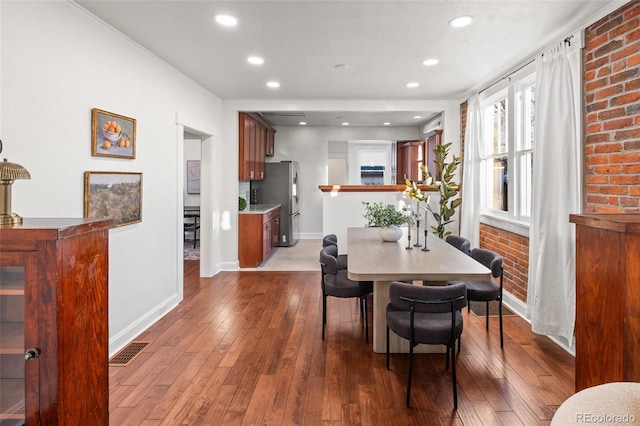 dining space featuring dark hardwood / wood-style flooring