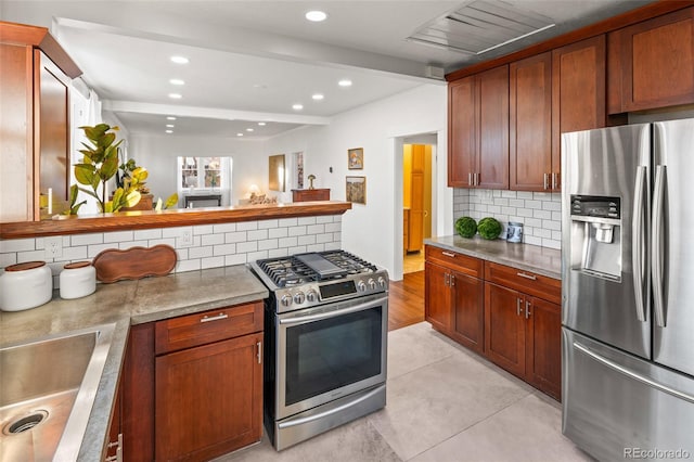 kitchen featuring light tile patterned flooring, sink, beamed ceiling, stainless steel appliances, and decorative backsplash