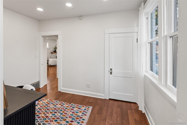 office space with dark hardwood / wood-style flooring