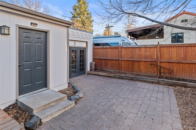 entrance to property featuring a patio