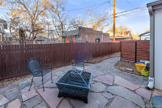 view of patio with an outdoor fire pit