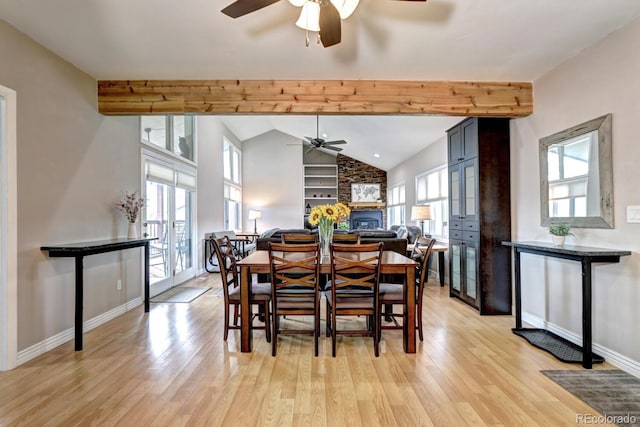 7877 S University Way, Centennial, CO 80122 - dining space featuring ceiling fan, a fireplace, light wood-style floors, and baseboards