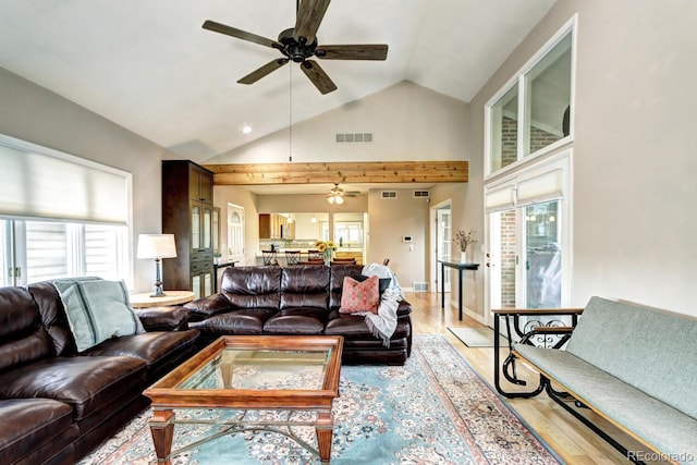 7877 S University Way, Centennial, CO 80122 - living room featuring a ceiling fan, light wood-style flooring, healthy amount of natural light, and high vaulted ceiling