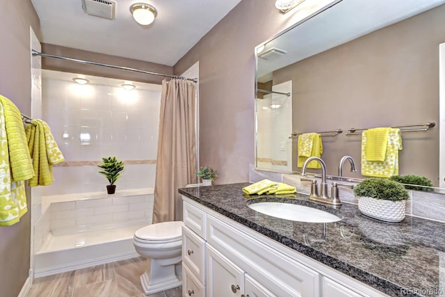 7877 S University Way, Centennial, CO 80122 - full bathroom with toilet, vanity, and tiled shower