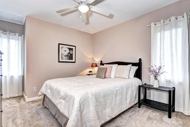 7877 S University Way, Centennial, CO 80122 - bedroom featuring light carpet, baseboards, and ceiling fan