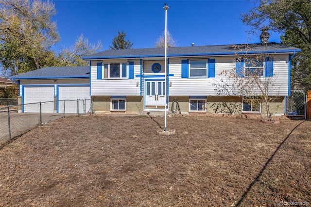 7003 Cleveland Ct, Colorado Springs, CO 80911 - bi-level home featuring driveway, roof with shingles, and a garage