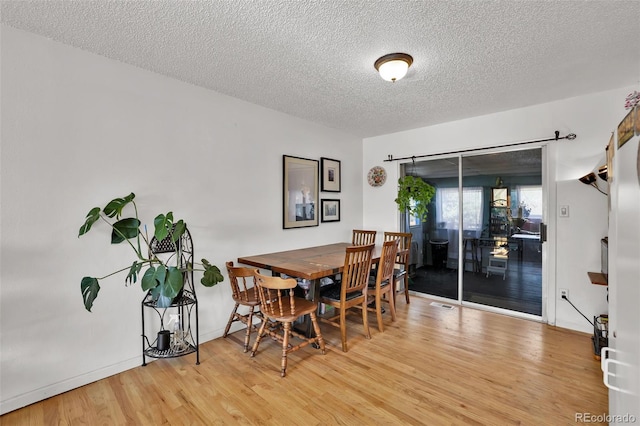 7003 Cleveland Ct, Colorado Springs, CO 80911 - dining area with wood finished floors and a textured ceiling