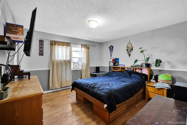 7003 Cleveland Ct, Colorado Springs, CO 80911 - bedroom with a textured ceiling and wood finished floors