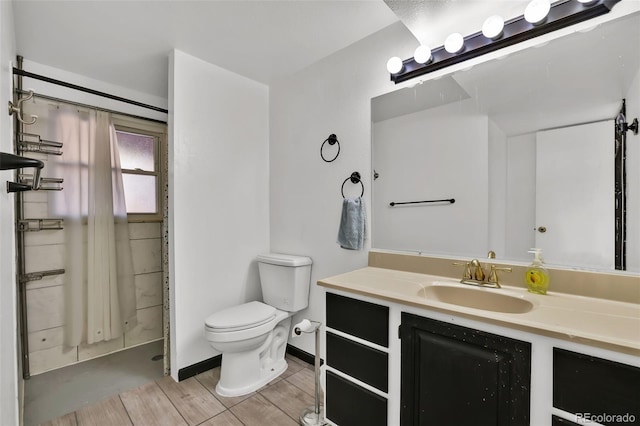 7003 Cleveland Ct, Colorado Springs, CO 80911 - full bath featuring toilet, wood finished floors, vanity, and curtained shower