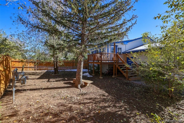 7003 Cleveland Ct, Colorado Springs, CO 80911 - fenced yard featuring a wooden deck and stairway