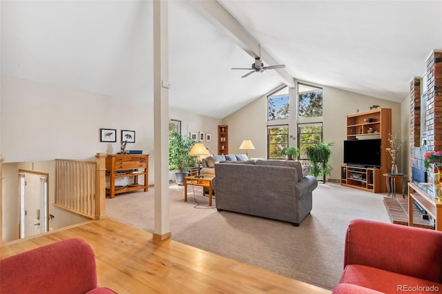 living room with carpet floors, beam ceiling, high vaulted ceiling, and ceiling fan