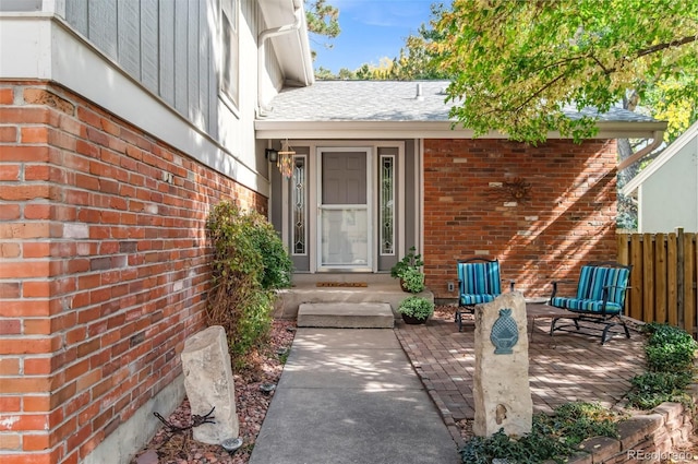 entrance to property with a patio