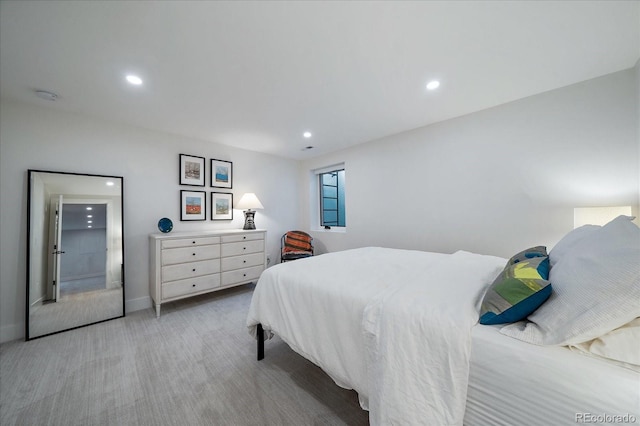 bedroom featuring light carpet