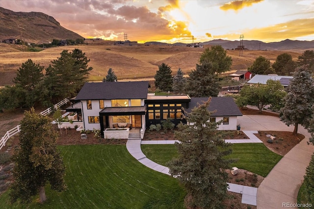 aerial view at dusk with a mountain view