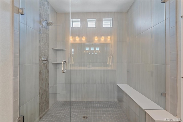 bathroom with a shower with shower door