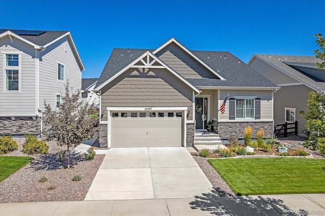 craftsman-style house with a front lawn and a garage