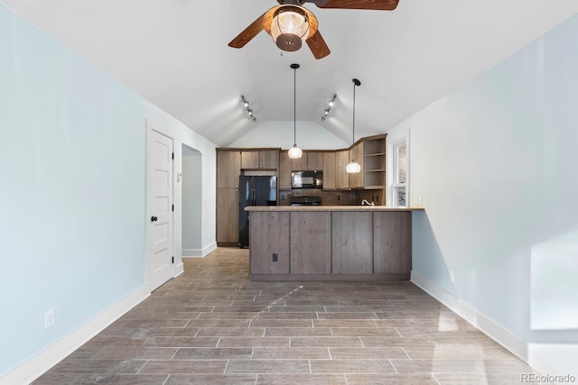 kitchen featuring black appliances, kitchen peninsula, pendant lighting, lofted ceiling, and tasteful backsplash