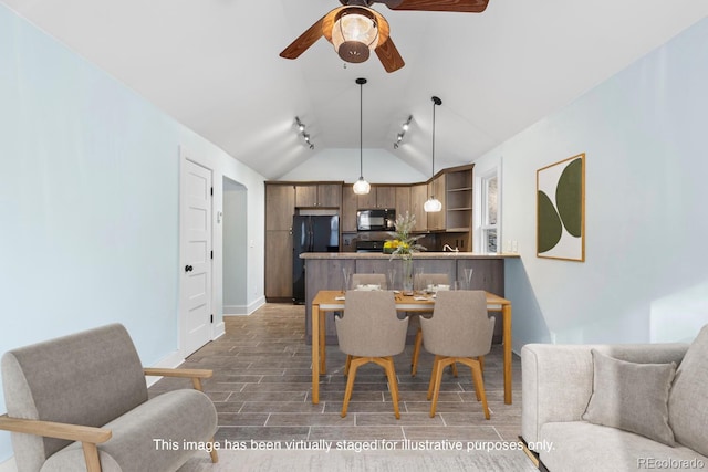 401 Chase St, Black Hawk, CO 80422 - dining room with vaulted ceiling, ceiling fan, wood finished floors, baseboards, and track lighting